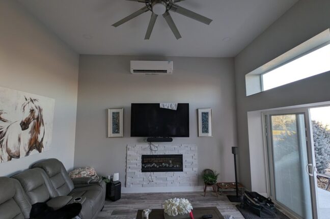 A room with a wall-mounted heat-pump system, wall-mounted
